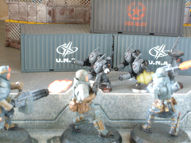 U.N.A. Steel Troopers firing on Tau Stealth Suits